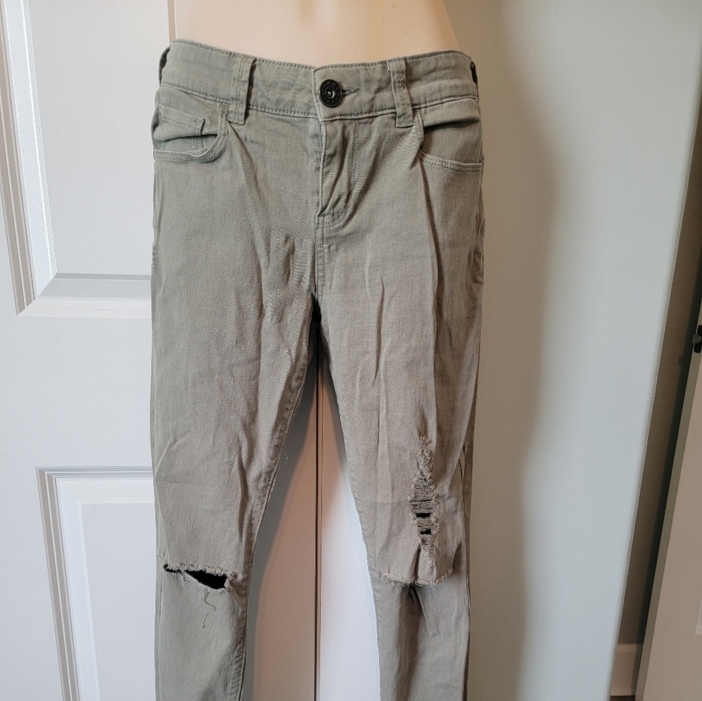 Olive colored distressed skinny jeans